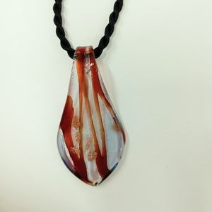 Glass pendant, Murano glass. Brown, tan & clear with glitter. Black cord.